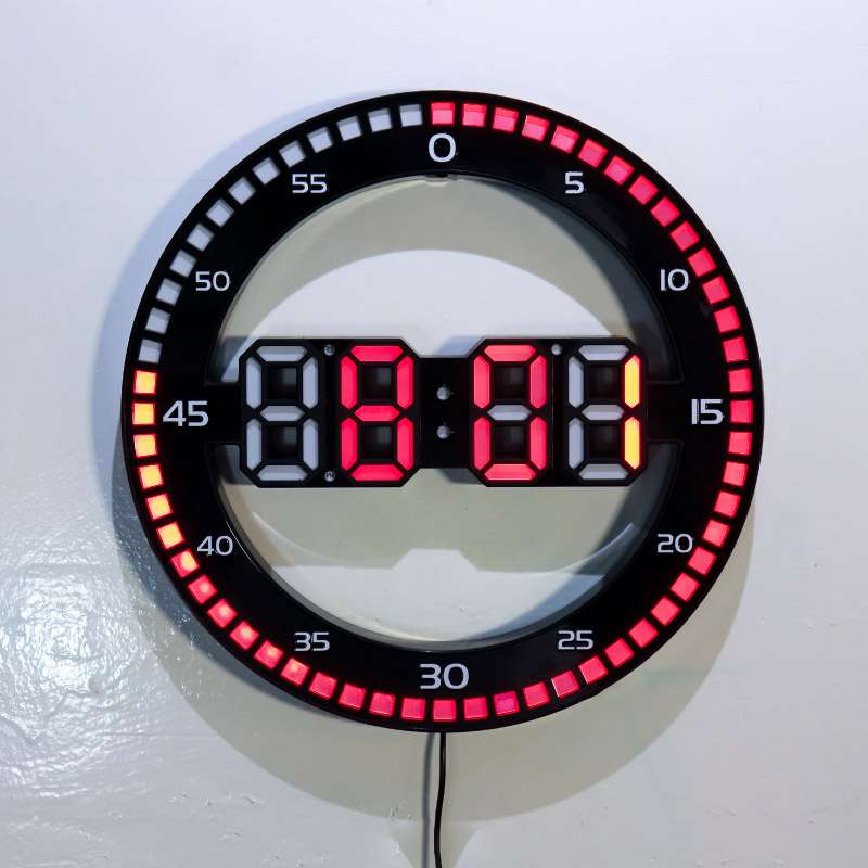 black round digital wall clock with hours and seconds
