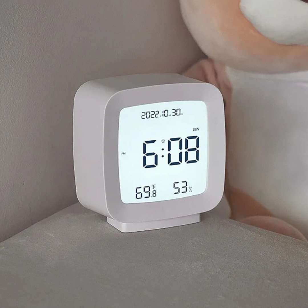 small desktop white LCD Digital clock displaying temperature, humidity and time