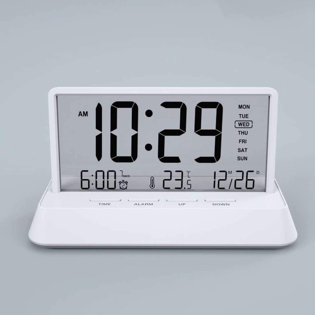 white LCD desktop clock with large digits